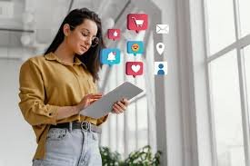 Woman using tablet with social media icons