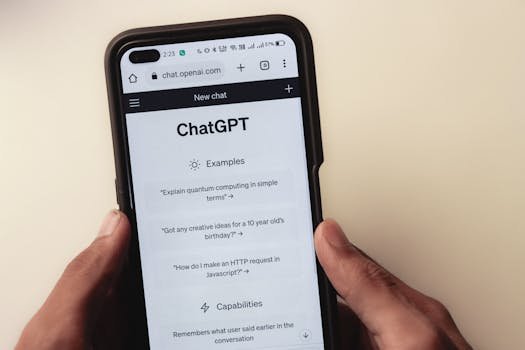 pexels-photo-16629368-16629368 Close-up of hands holding a smartphone displaying the ChatGPT application interface on the screen.